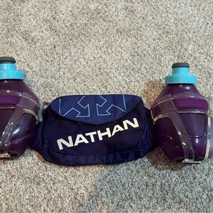 Nathan brand running belt with bottles.